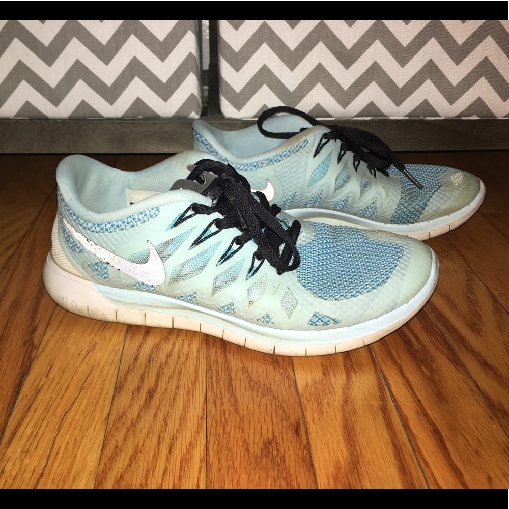 Tiffany blue Nike reflecting sneakers.